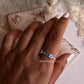 Elegant 3-stone blue topaz band in sterling silver