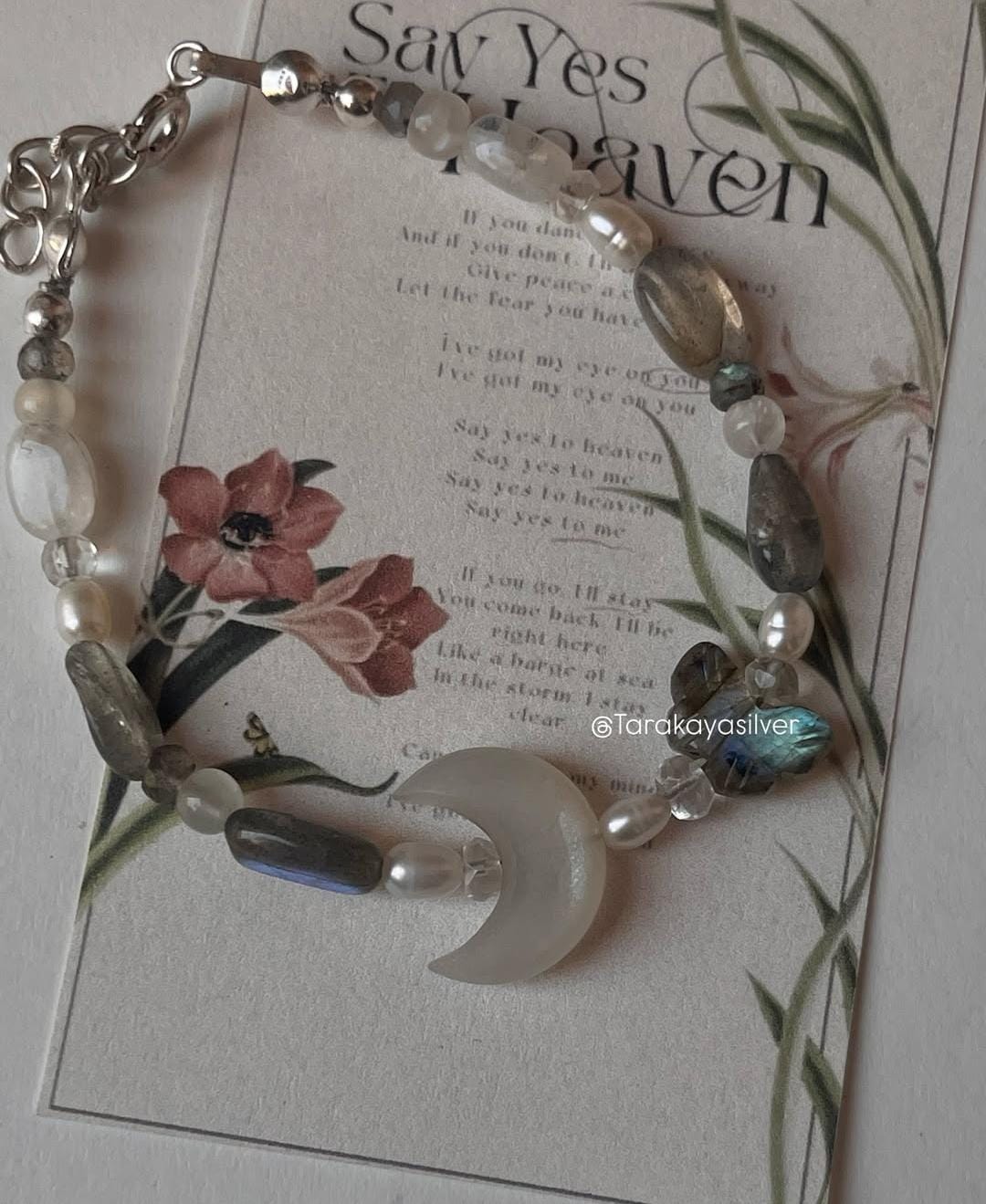 Elegant handcrafted silver bracelet with mystical wing accents  