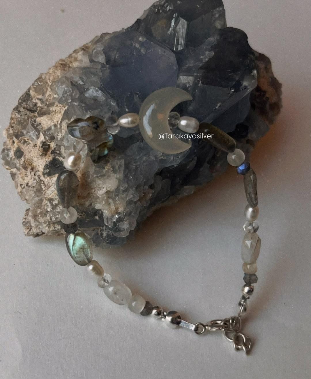 Handmade silver bracelet featuring mystical wings for protection  
