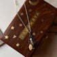 Ganesha face silver pendant on a necklace with a decorative wooden gift box, perfect for unique gifting occasions.