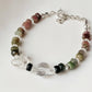Elegant silver bracelet featuring handcrafted tourmaline and clear quartz  