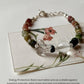 Elegant silver bracelet featuring handcrafted tourmaline and clear quartz  