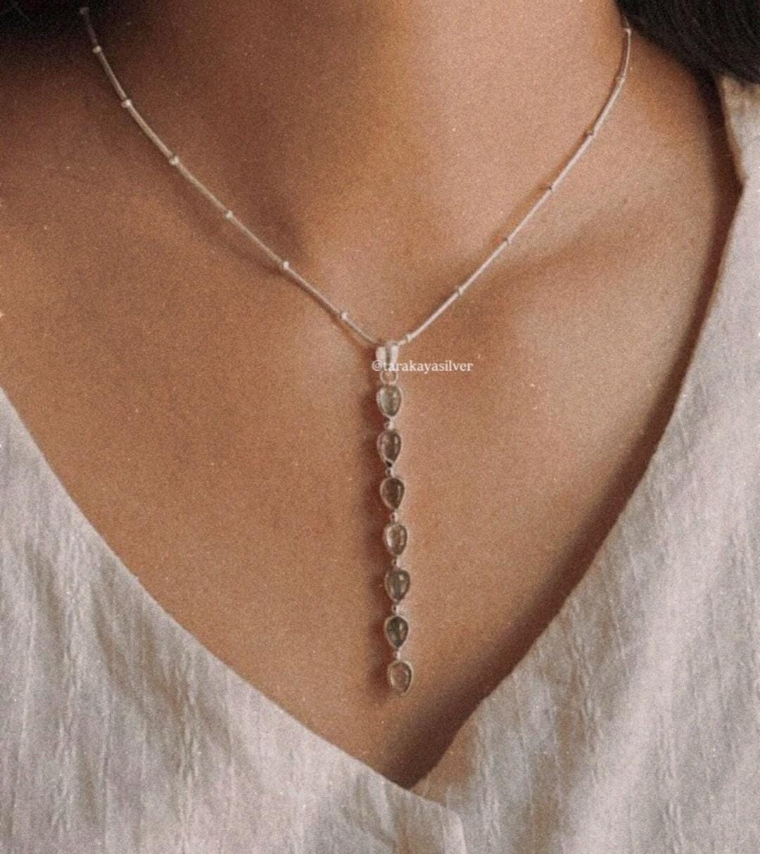 Faceted pink tourmaline pear pendant on sterling silver chain  