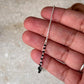 Protective silver anklet with black beads and chain