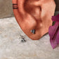 Dainty flower-shaped sterling silver studs with white CZ  
