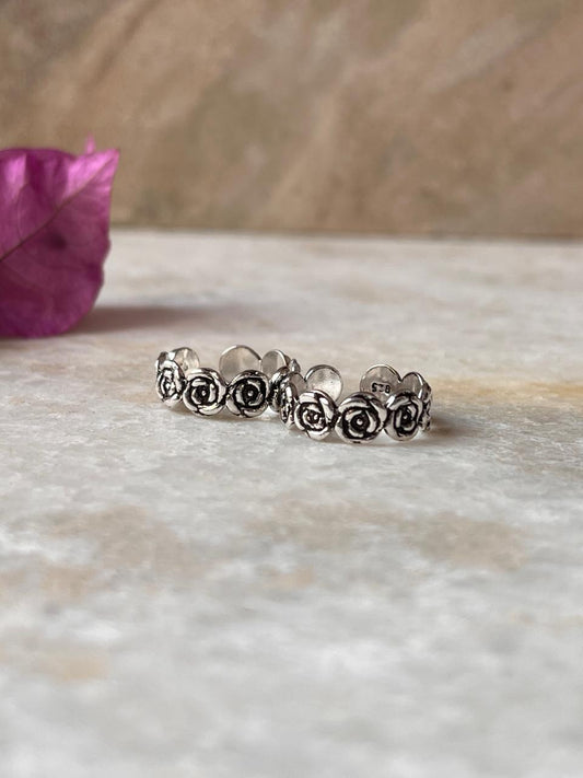 Handcrafted rose motif toe ring in pure silver