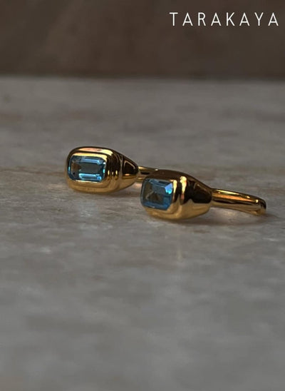 Delicate gold vermeil huggies with natural 925 sterling silver blue topaz