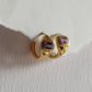 Handcrafted gold vermeil huggies with amethyst gemstones