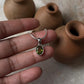Elegant Oval Peridot Pendant in Silver Setting
