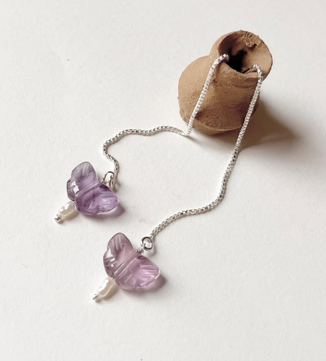 Threader earrings with freshwater pearl and amethyst butterfly charm