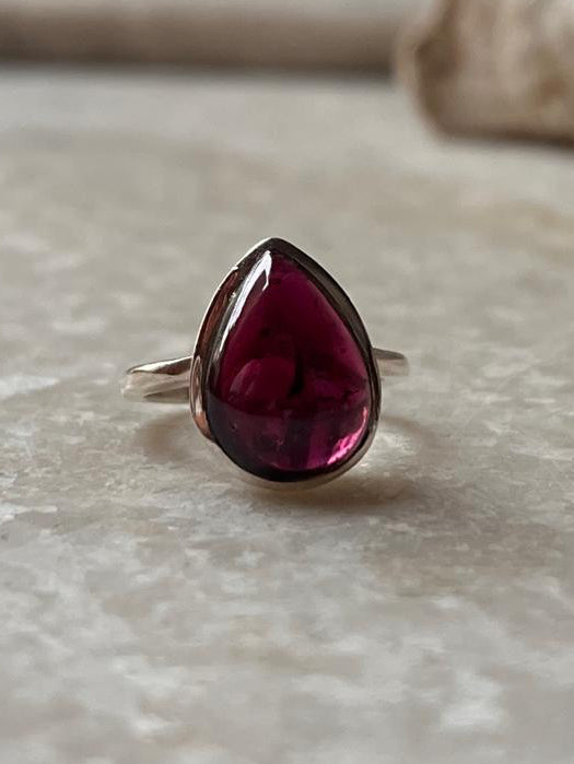 925 Sterling Silver Garnet Pear Plain Big Ring featuring a deep red garnet stone on a minimalist band.