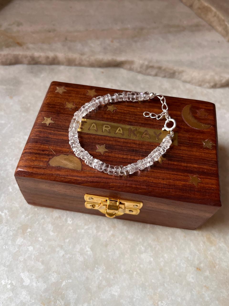 Transparent crystal bracelet with flat quartz beads  