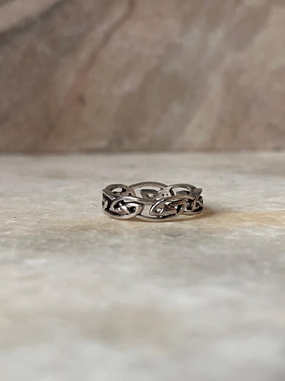 Full band ring with intricate Celtic knot design  