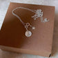 White topaz north star pendant with engraved initial sterling silver necklace