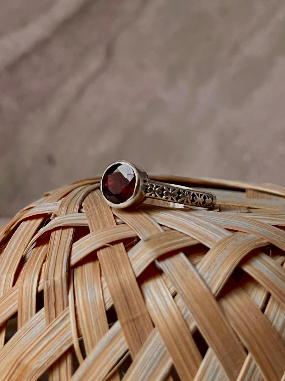 Artisan garnet solitaire silver ring with intricate vintage band