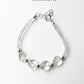 Heart-shaped clear quartz crystal bracelet with silver beads  