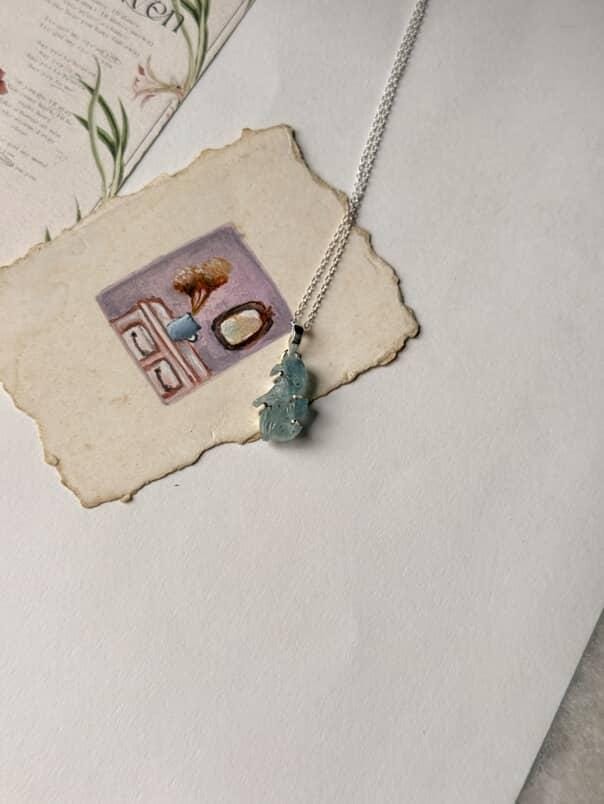 Handcrafted aquamarine pendant with forest enchantment design  