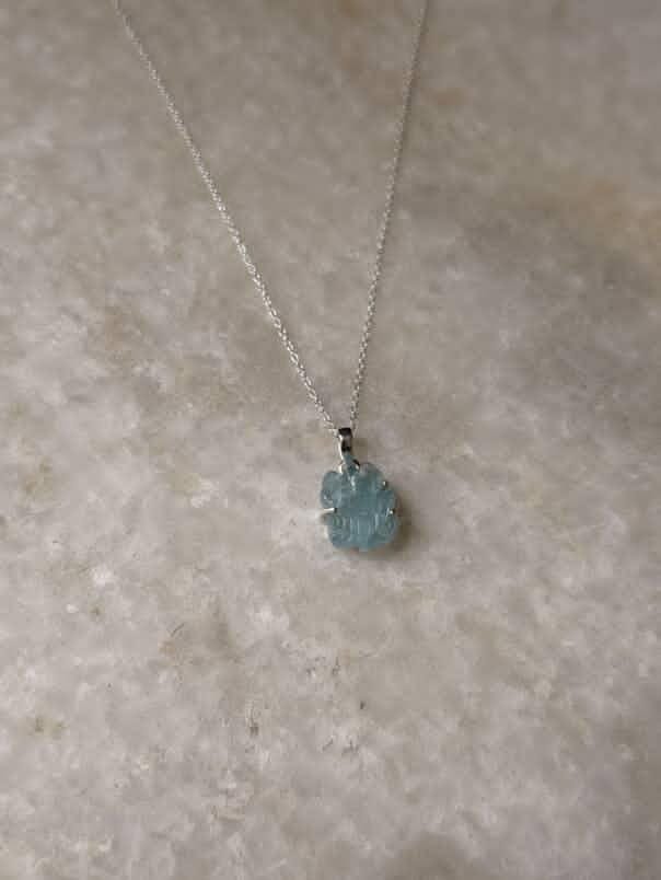 Elegant aquamarine silver pendant with forest design  