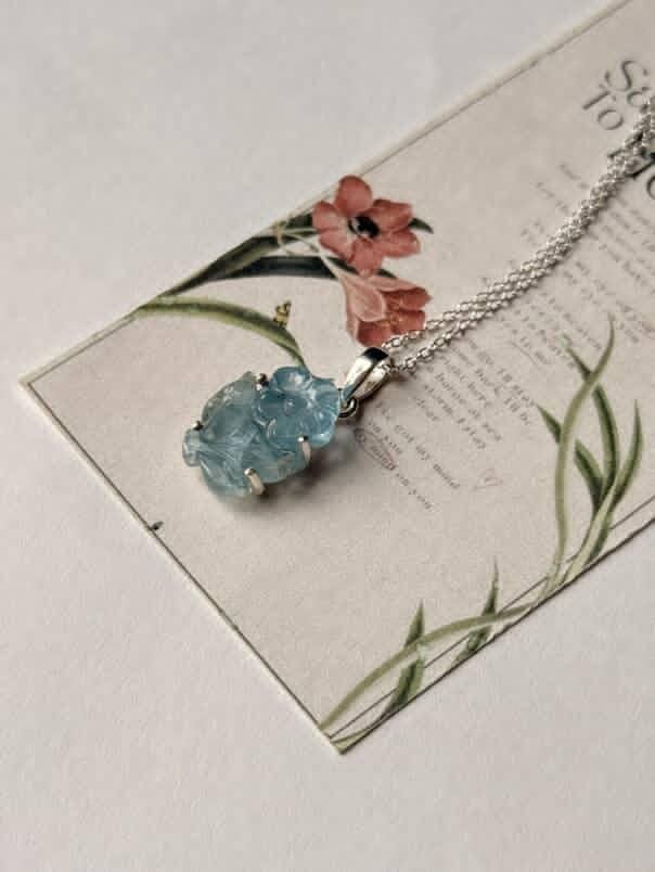 Handcrafted aquamarine pendant with forest-inspired design