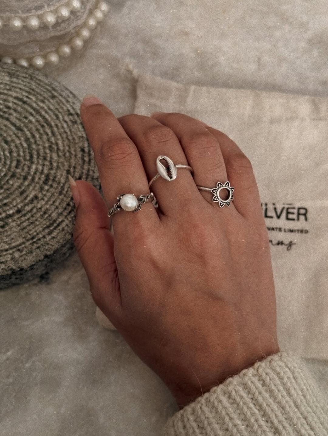 Elegant 925 sterling silver ring featuring forest pearl, cowrie seashell, and Soorajmukhi design