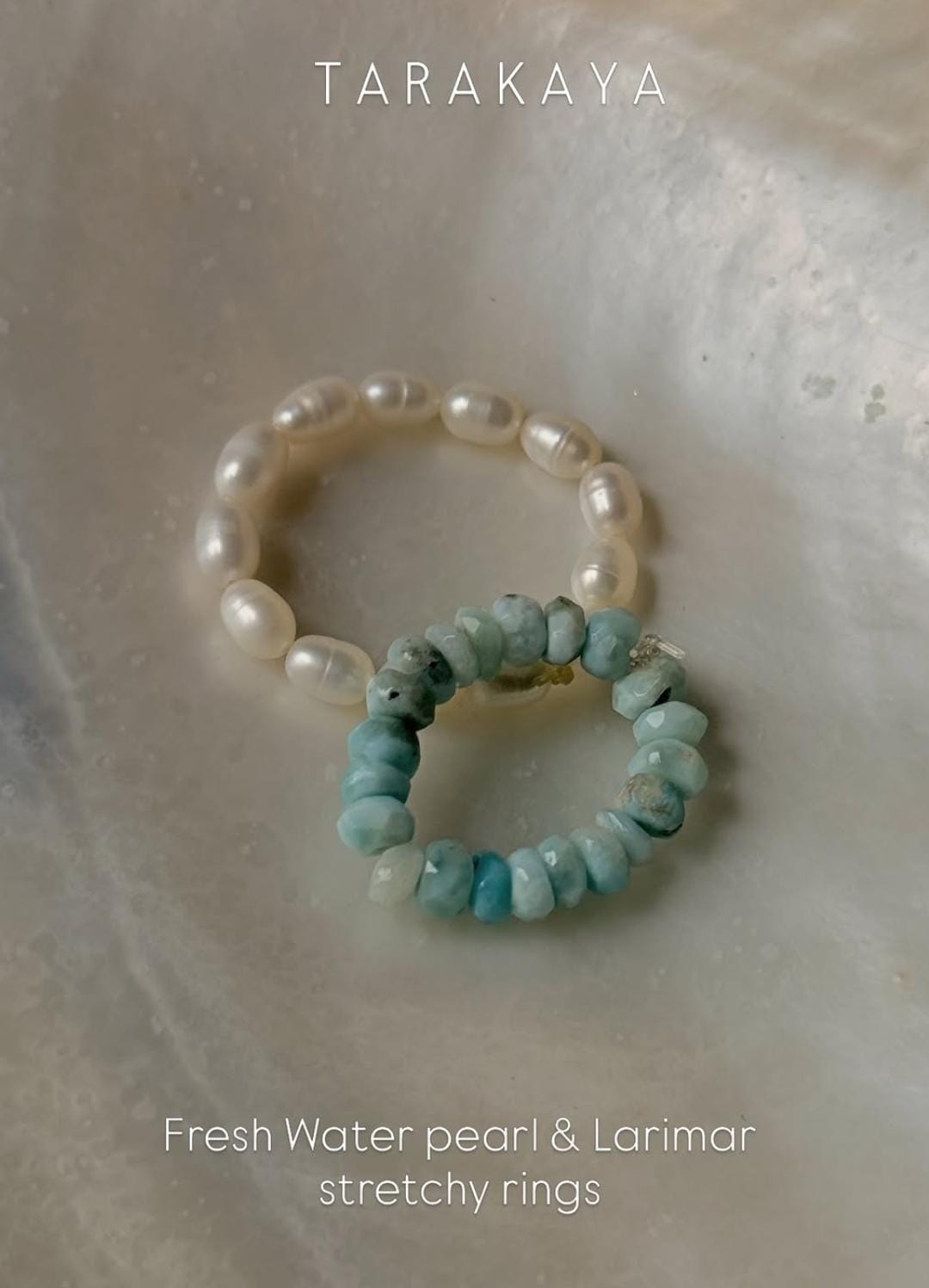 Natural Crystal stretchy rings featuring Fresh Water pearl and Larimar gemstones on a soft background.